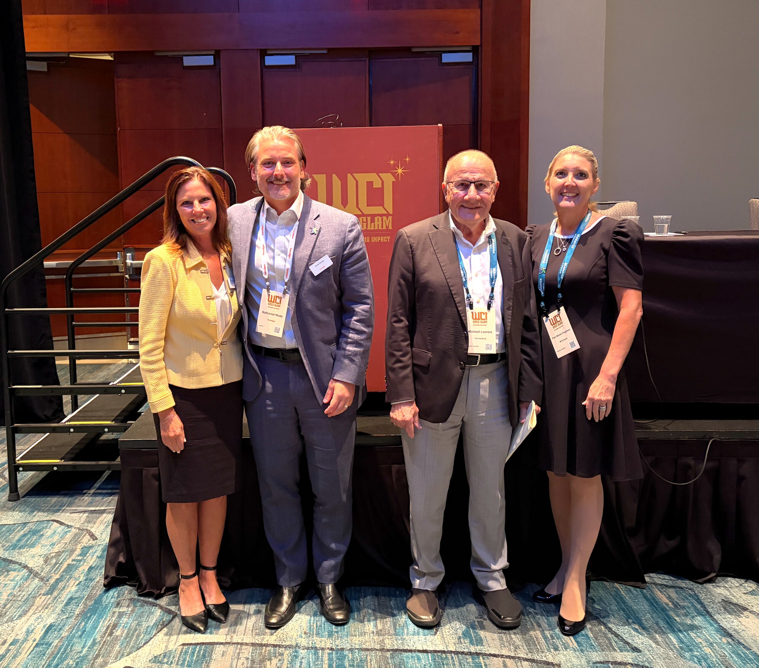 Kathy Galia and fellow presenters pose for a picture after their panel session at WCI