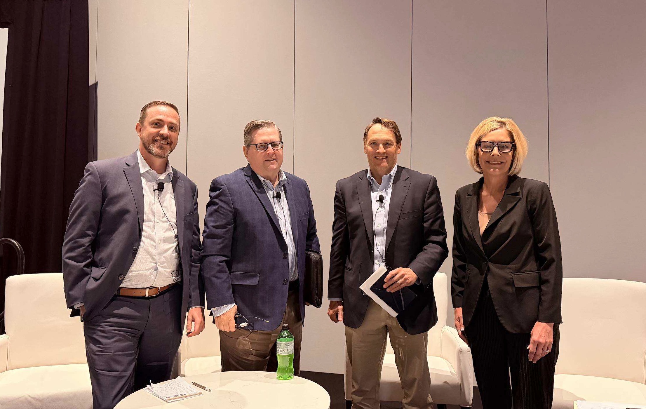 Shannon Ford and fellow panelists pose for a photo after their panel session at WCI 2026